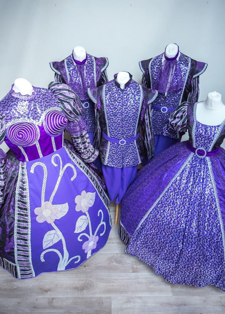 purple finale and ensemble costumes
